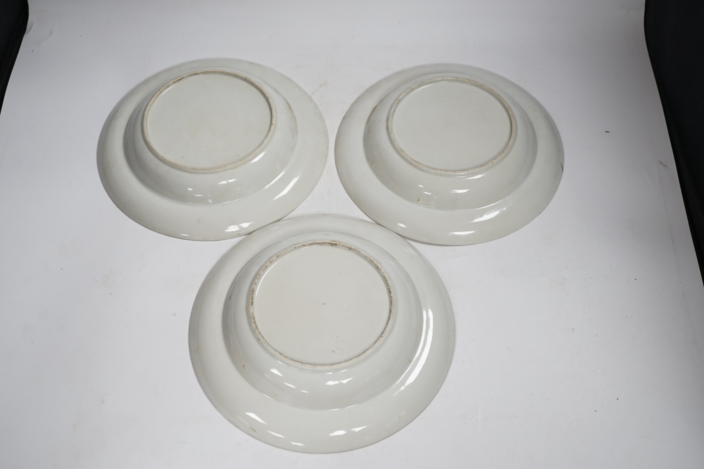 Three early 19th century Chinese famille rose soup plates, 25.5m diameter